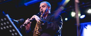 Andy Firth playing clarinet on stage